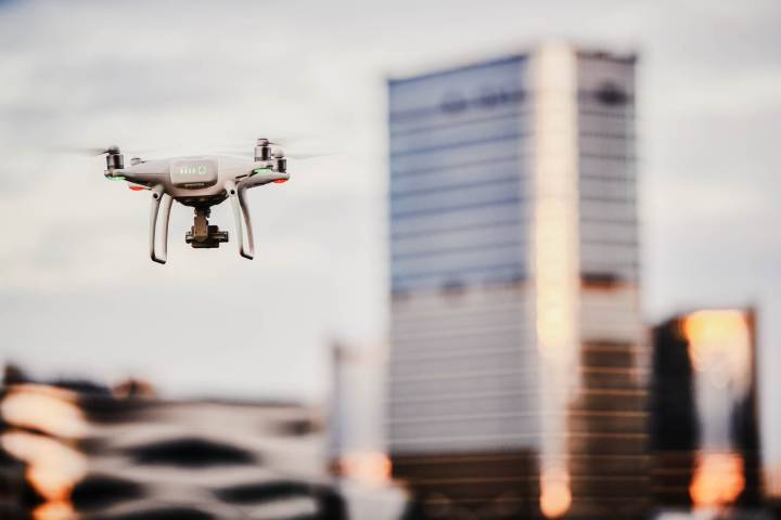 Focus shot of a drone flying in the city sky